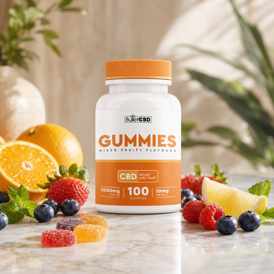 BulletCBD broad spectrum CBD gummies with mixed fruity flavours, 1000mg per tub and 100 gummies, displayed with fresh fruit and gummy sweets