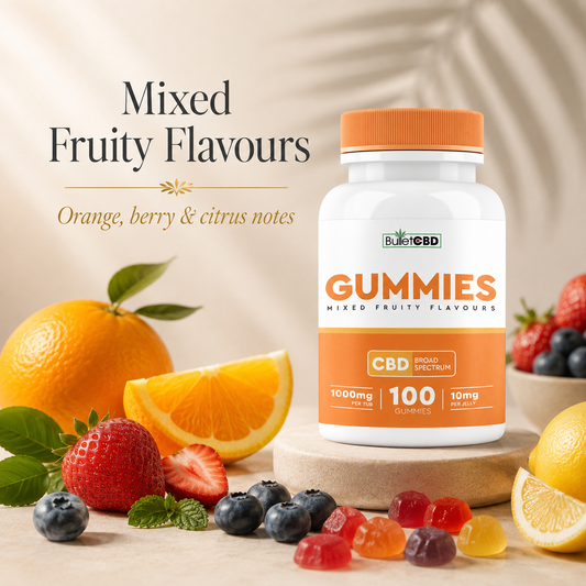 BulletCBD mixed fruity flavour CBD gummies with orange, berry and citrus notes, shown with fresh fruit and colourful gummies